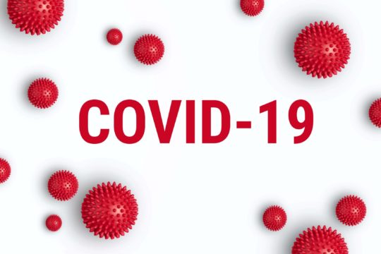 COVID-19 spelled out surrounded by the virus.