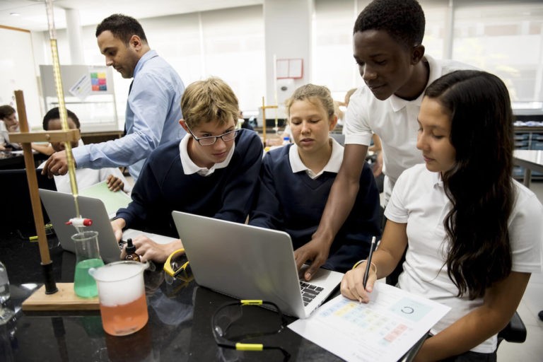 A group of students working on a science experiment together.