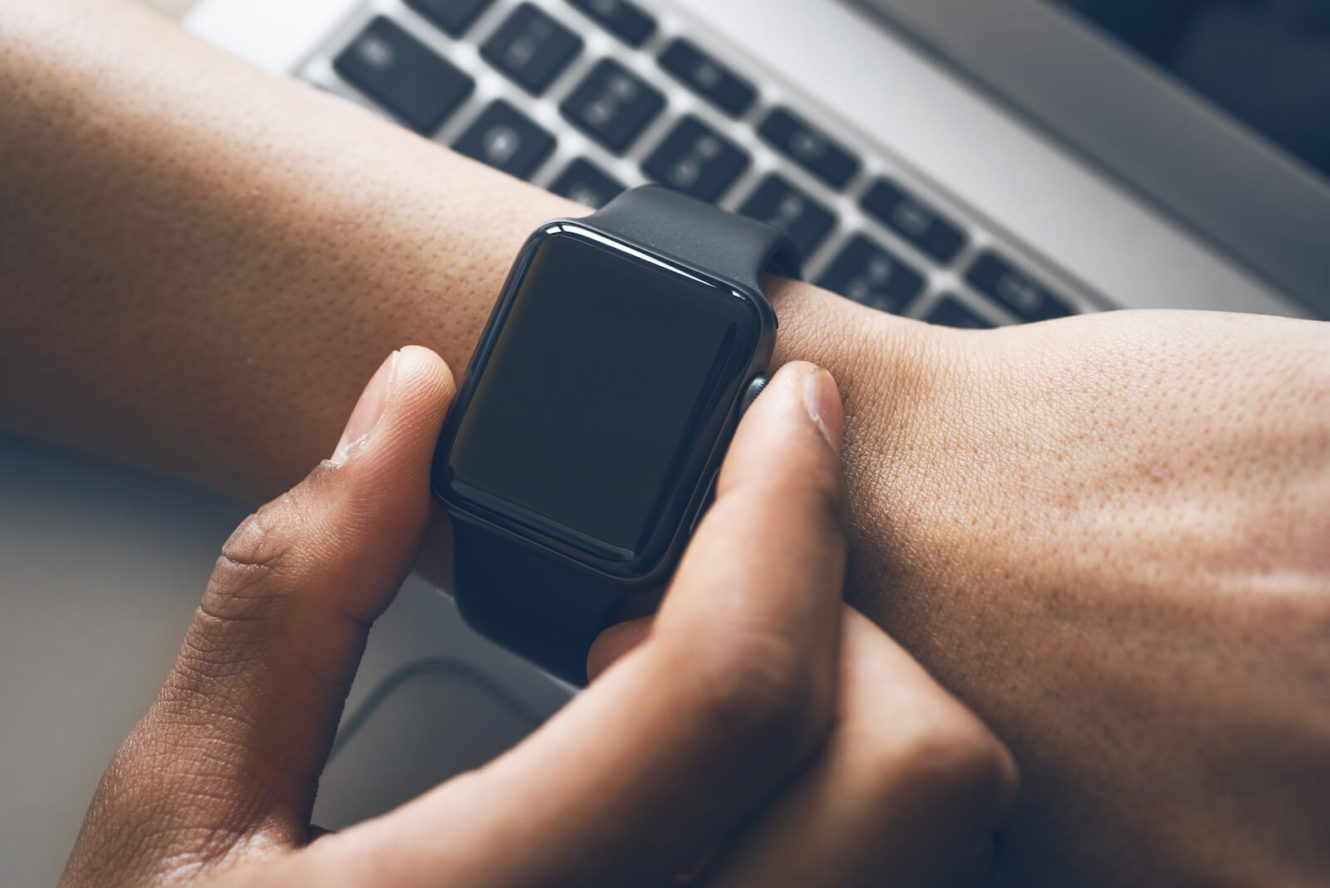 Man looking at smart watch on his wrist