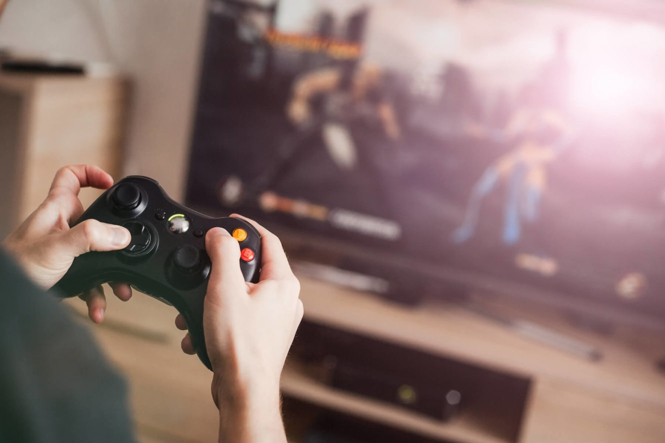 Boy playing video games in front of a tv